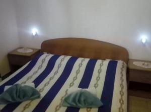 Ένα ή περισσότερα κρεβάτια σε δωμάτιο στο Cozy Robinson Crusoe-Style House