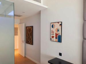 a hallway with two framed paintings on the wall at Showcase Hotel Kota Kinabalu in Kota Kinabalu