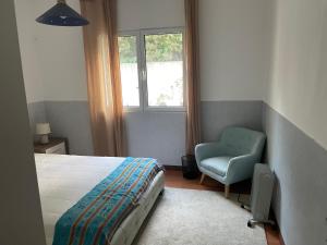 Ένα ή περισσότερα κρεβάτια σε δωμάτιο στο Casa dos Plátanos