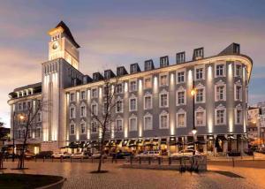 a large building with a clock tower on top of it at The João I Collection Two Bedroom in Lisbon