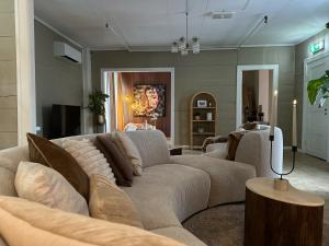 a living room with a couch and a table at Huset Vårt - Bed and Breakfast in Hornindal