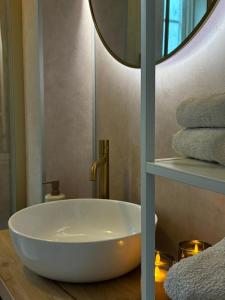 a bathroom with a large white bath tub on a table at Huset Vårt in Hornindal +23 photos
