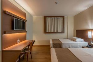 Postel nebo postele na pokoji v ubytování Hotel Caiuá Cascavel + 30 fotografií