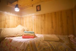 a bedroom with a bed with four pillows on it at Interfaith Retreats in New York