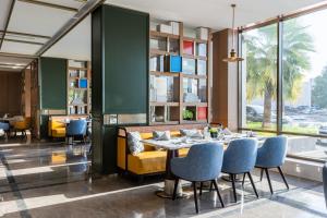 a dining room with a table and chairs at Braira Al Ahsa in Al Ahsa
