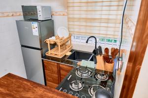 Η κουζίνα ή μικρή κουζίνα στο Birds of paradise homes 1