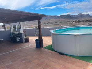 a hot tub on the patio of a house at Las Catalinas in Gran Tarajal