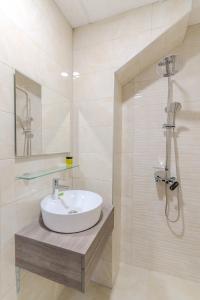 Ένα μπάνιο στο Cappo Aparthotel