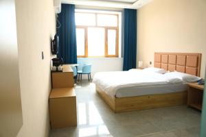 Hongge Hotel - Harbin Taiping Airport客房内的一张或多张床位