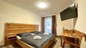 TV a/nebo společenská místnost v ubytování Hotel Kennedy