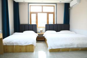 Hongge Hotel - Harbin Taiping Airport客房内的一张或多张床位