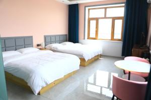 Hongge Hotel - Harbin Taiping Airport客房内的一张或多张床位