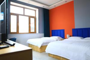 Postel nebo postele na pokoji v ubytování Hongge Hotel - Harbin Taiping Airport + 28 fotografií