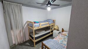 Ένα ή περισσότερα κρεβάτια σε δωμάτιο στο Departamento en tercer piso por escaleras +10 φωτογραφίες