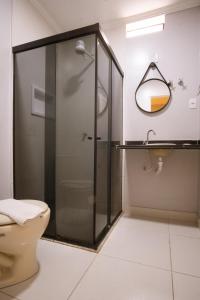 a bathroom with a shower and a toilet at Marezzi Hotel Aracaju in Aracaju +27 photos