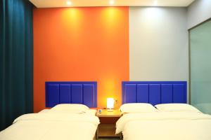 Hongge Hotel - Harbin Taiping Airport客房内的一张或多张床位