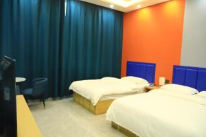 Hongge Hotel - Harbin Taiping Airport客房内的一张或多张床位