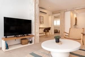 a living room with a large flat screen tv at K-DOCK by Nuka Homes in Jávea