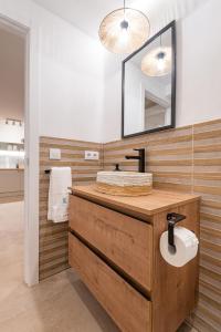 a bathroom with a wooden sink and a mirror at K-DOCK by Nuka Homes in Jávea +51 photos