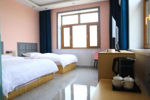 Hongge Hotel - Harbin Taiping Airport客房内的一张或多张床位