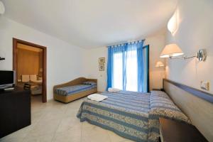 Postel nebo postele na pokoji v ubytování Hotel Riviera + 29 fotografií
