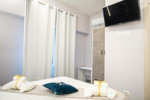 TV a/nebo společenská místnost v ubytování Napolitano Rooms - Central Station