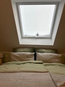 Postel nebo postele na pokoji v ubytování Ferienhaus Waldsiedlung