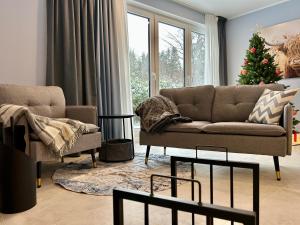 Posezení v ubytování Ferienhaus Waldsiedlung