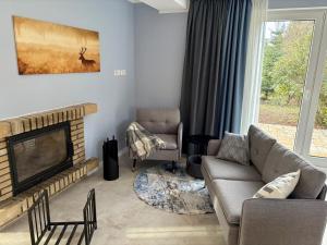 Posezení v ubytování Ferienhaus Waldsiedlung