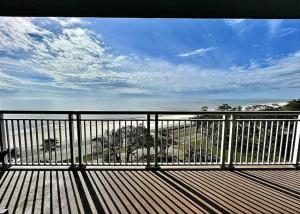 a balcony with a view of the beach and the ocean at Legacy Tower II 602 in Gulfport