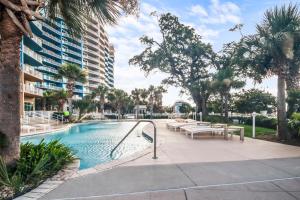 a swimming pool with a slide in a resort at Legacy Tower I 903 in Gulfport