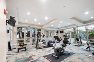 a gym with treadmills and elliptical machines at Legacy Tower I 903 in Gulfport