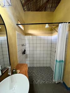 a bathroom with a shower and a sink at Finca Aisa -Boutique bungalows in Ometepe island in Santa Cruz +137 photos