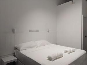 Postel nebo postele na pokoji v ubytování Avi Guesthouse