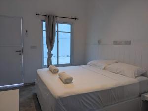 Postel nebo postele na pokoji v ubytování Avi Guesthouse