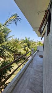 a balcony of a house with a view of the beach at La Consta in Acaraú