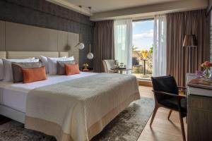 Ein Bett oder Betten in einem Zimmer der Unterkunft Anantara Grand Hotel Krasnapolsky Amsterdam