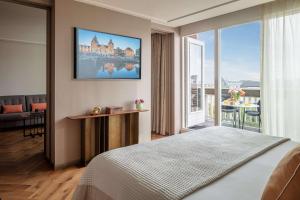 Ein Bett oder Betten in einem Zimmer der Unterkunft Anantara Grand Hotel Krasnapolsky Amsterdam