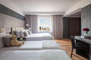 Ein Bett oder Betten in einem Zimmer der Unterkunft Anantara Grand Hotel Krasnapolsky Amsterdam