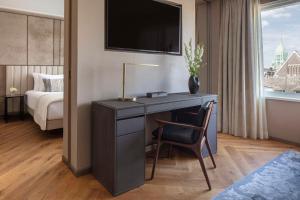 Ein Bett oder Betten in einem Zimmer der Unterkunft Anantara Grand Hotel Krasnapolsky Amsterdam