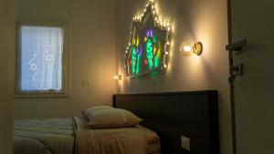 a bedroom with a bed and a stained glass window at Casa Paradiso in Castronuovo di Sicilia