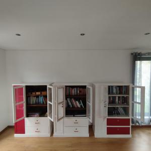 a room with white cabinets and bookshelves at Fabulous 5 BR hidden gem Serra da Estrela in Vinhó