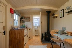 a kitchen with a sink and a stove in a room at Walltree House in Brackley +24 photos