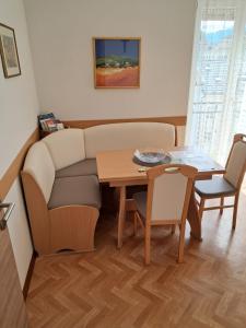 a living room with a couch and a table at Guesthouse48 in Bolzano