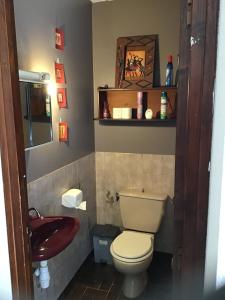 a bathroom with a toilet and a sink at Apartment in cozy house with terrace in Aspres-sur-Buëch