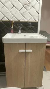 a bathroom sink with a white counter top at maison individuelles pour 16 personnes in Lieusaint