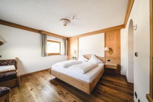 Postel nebo postele na pokoji v ubytování Hotel Christoph