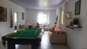a living room with a pool table in it at Sitio São Francisco de Assis in São Pedro de Alcântara
