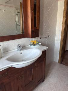 a bathroom with a white sink and a shower at Antica Vigna Toscana in Poppi +31 photos