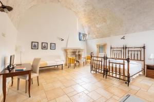 A bed or beds in a room at Palazzo San Giovanni